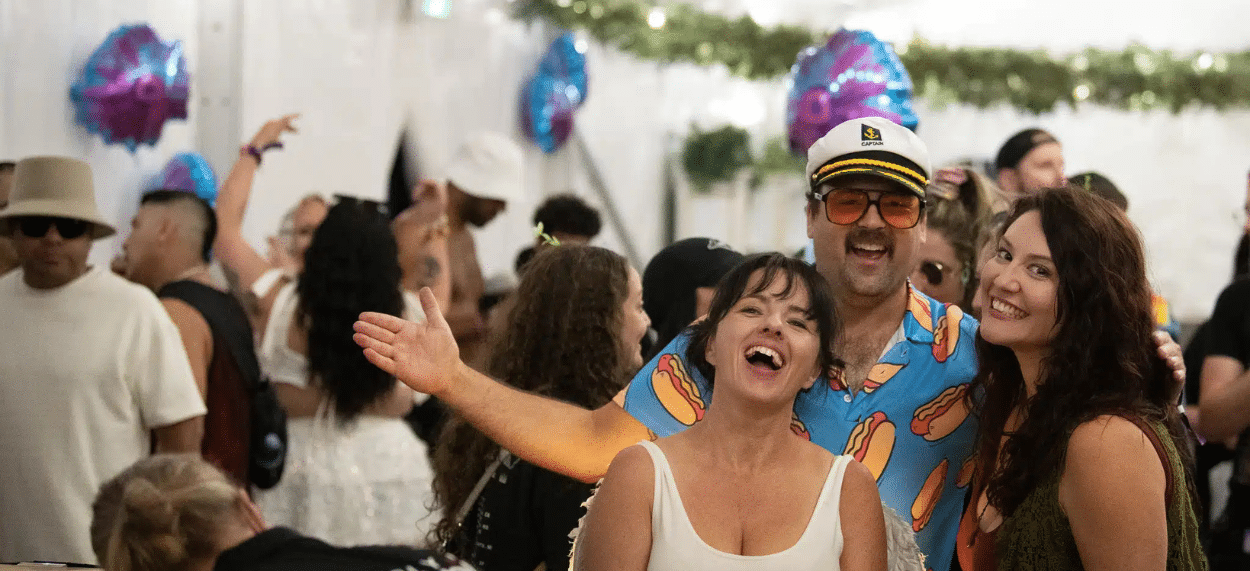 Private corporate event at Waterfront Park in Calgary with guests having fun, smiling, posing for a picture